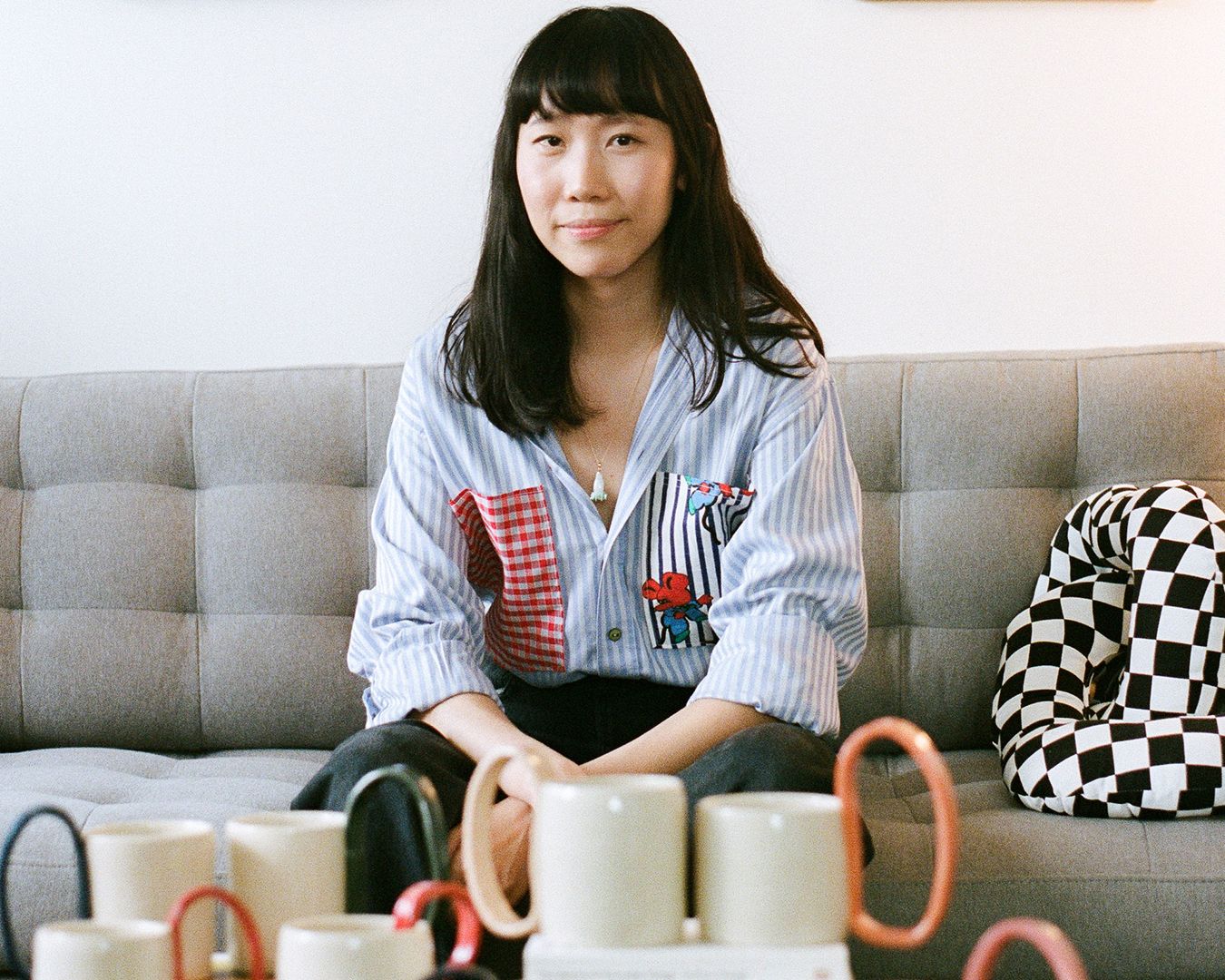 Wendy Ma with her ceramic mugs