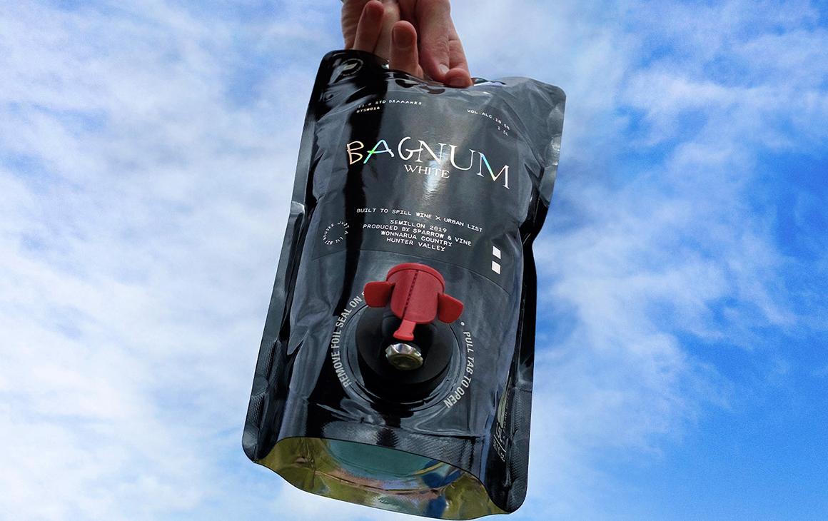 a Bagnum held up in the sky.