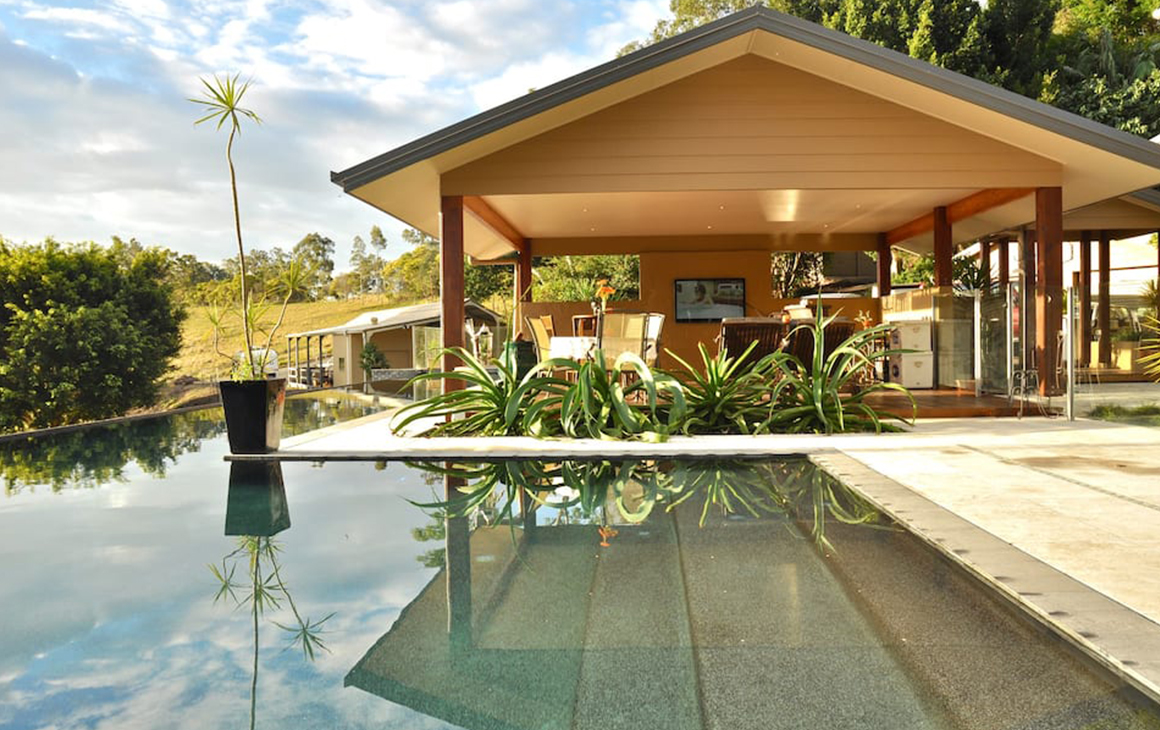 a pool with adjoining pavilion 