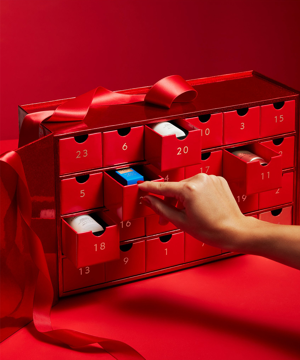 a red advent calendar with drawers