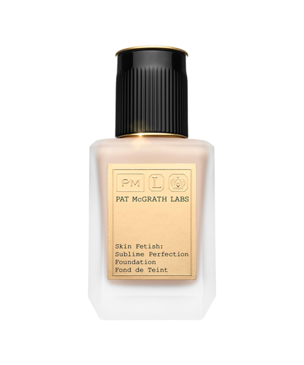 a clear bottle of foundation with a black lid.