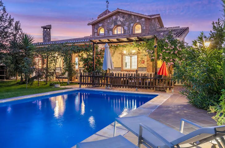 a mansion at sunset