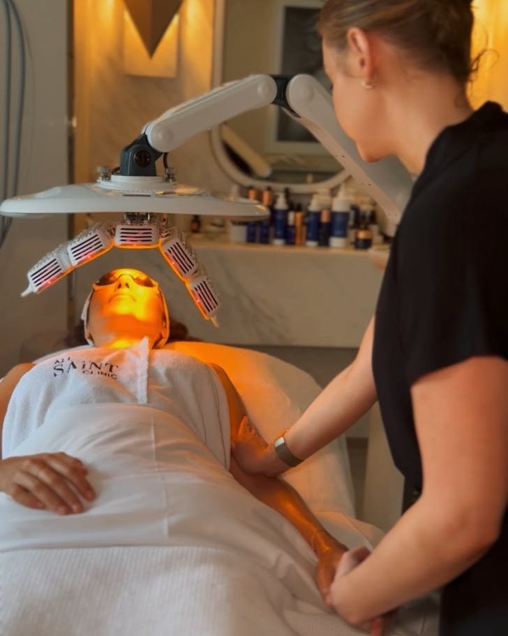 a person lying down getting a facial