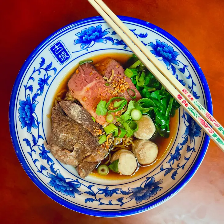 a bowl of beef noodle soup