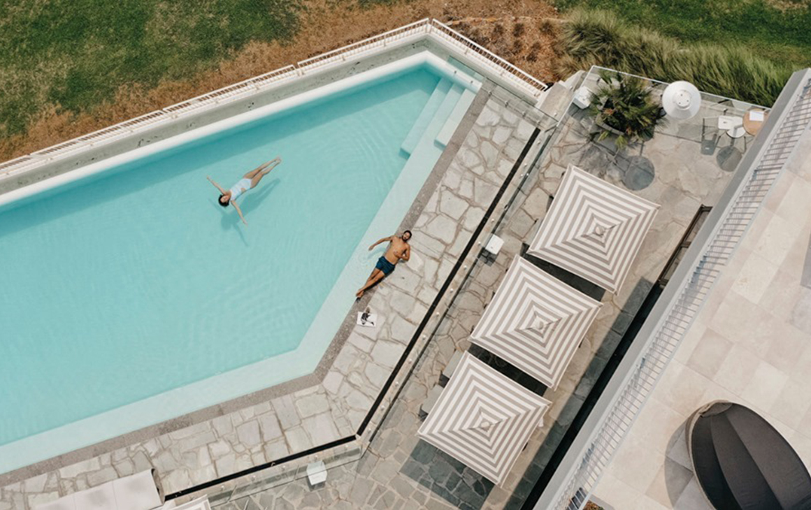 a woman floats in the pool at Bannisters Port Stephens