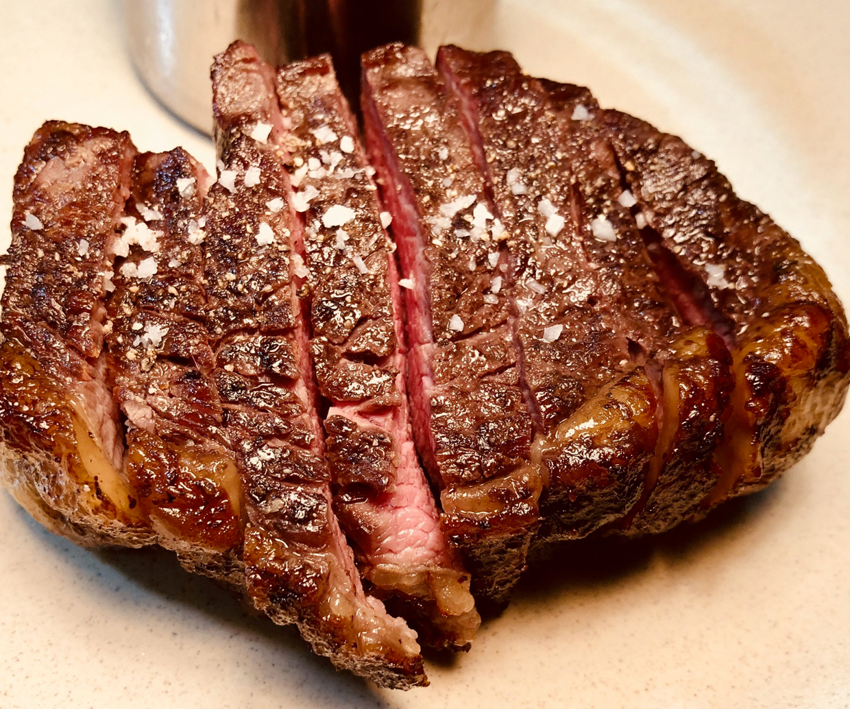 tenderly cut meat with salt flakes sprinkled on top