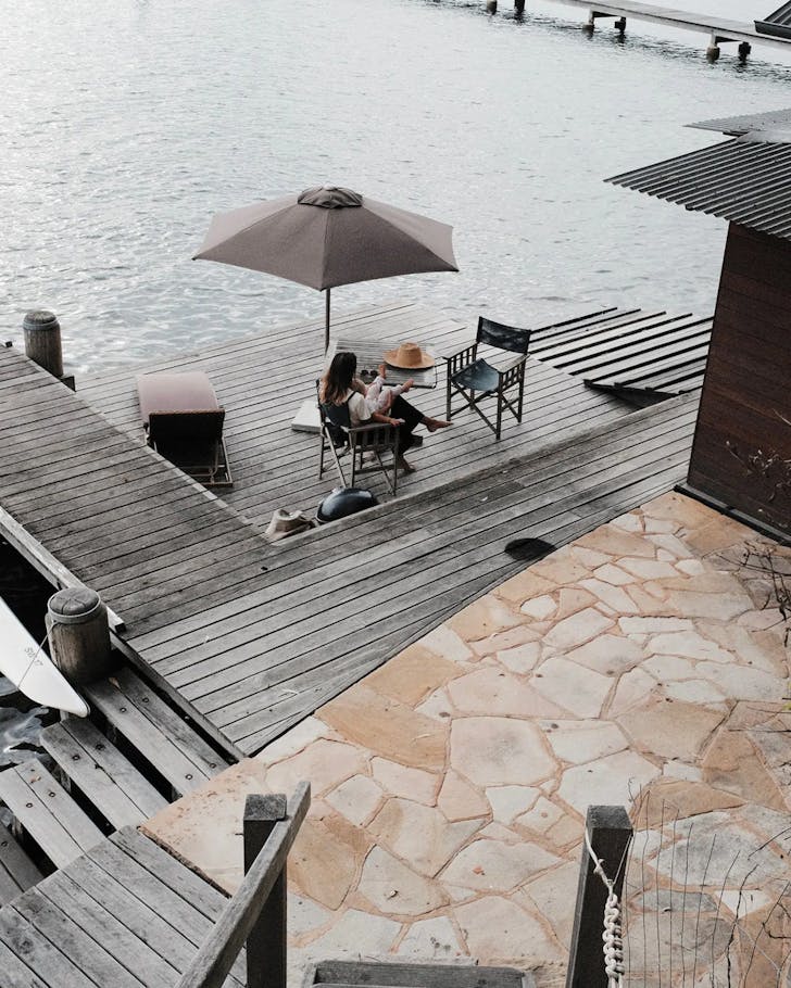 stairway leading down to girl reading on daybed on pontoon