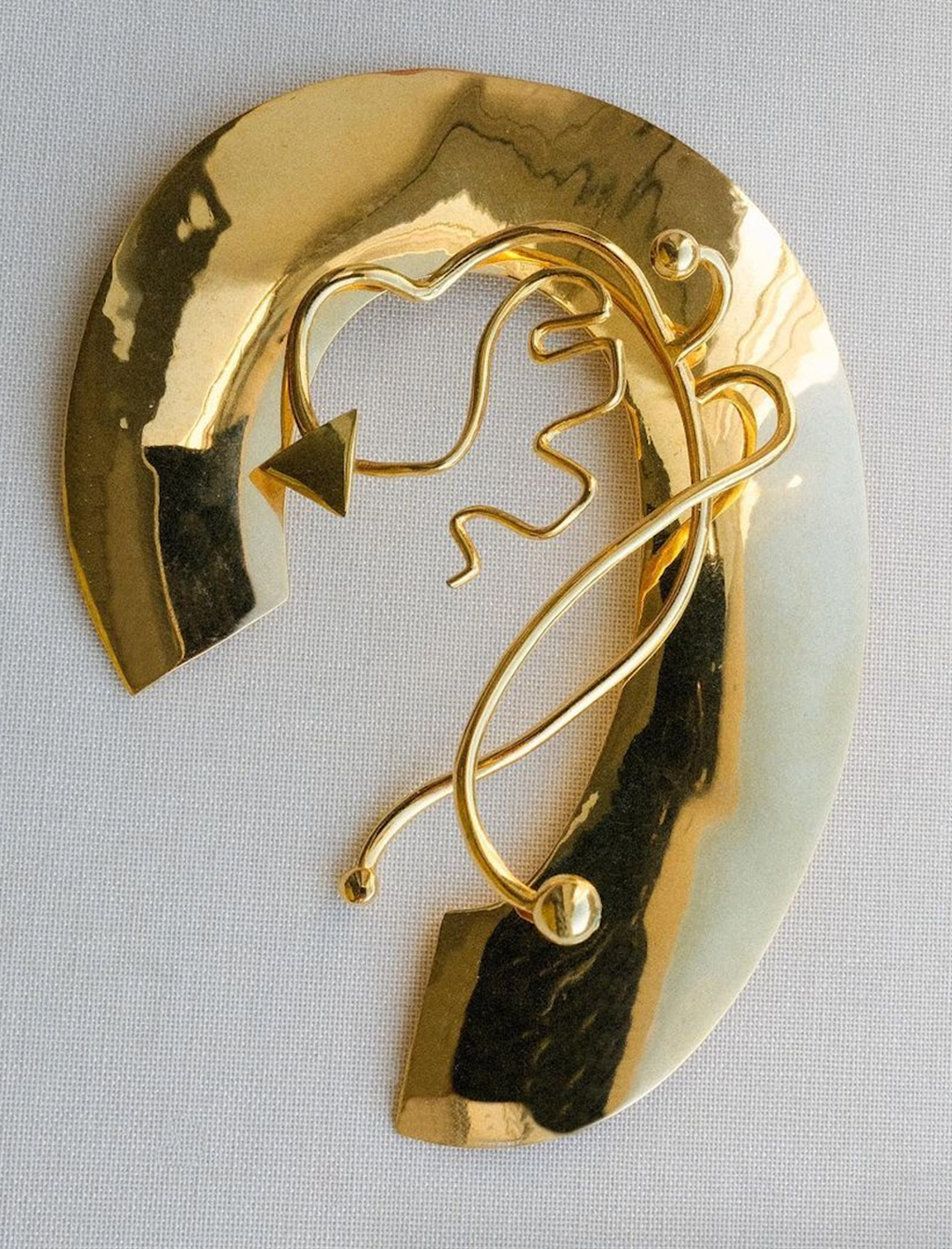 a piece of gold ear jewellery