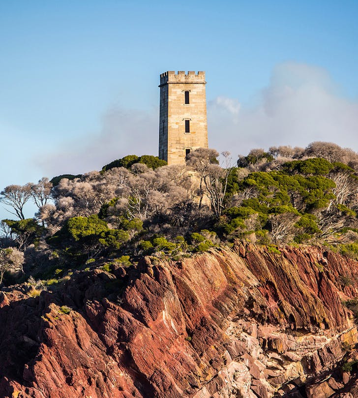 ben boyd tower on cliff at sunset