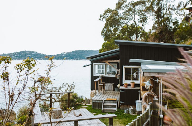 old beach shack in sydney's pittwater on the cliff decked out with nautical vices