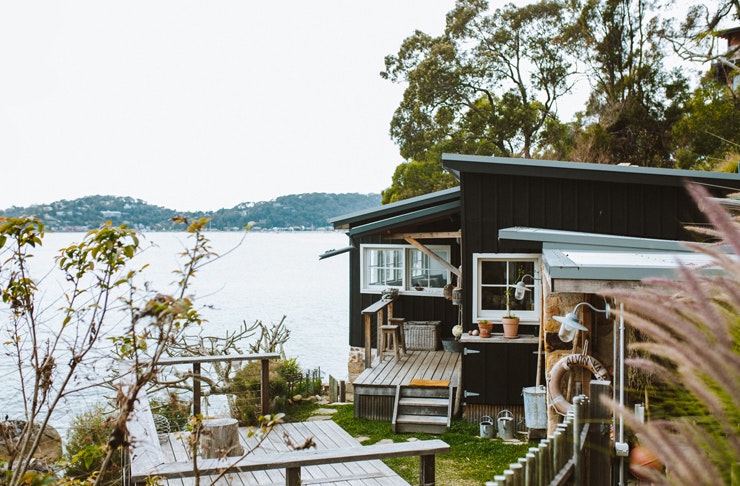 old beach shack in sydney's pittwater on the cliff decked out with nautical vices