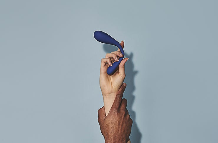 two hands holding a vibrator