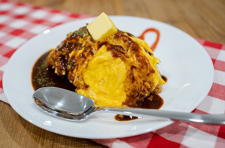 plate of omurice with demi glace sauce