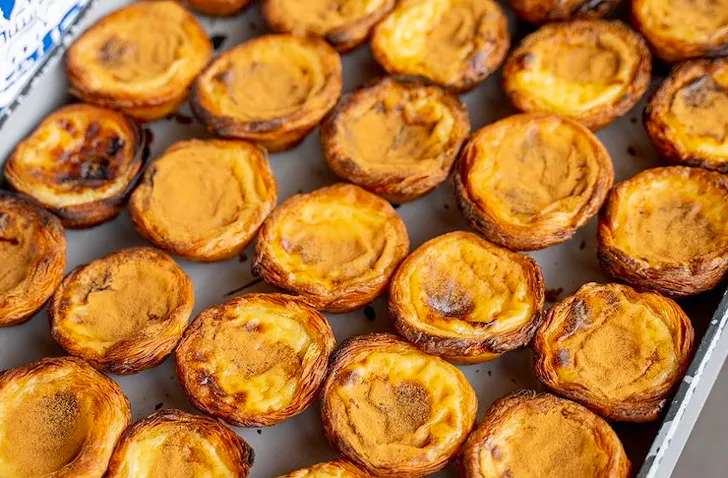 platter of freshly baked portuguese tarts