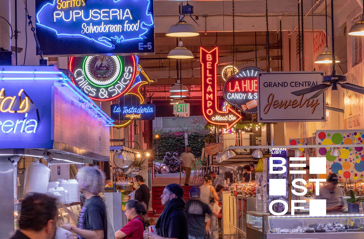 a busy marketplace with neon lights