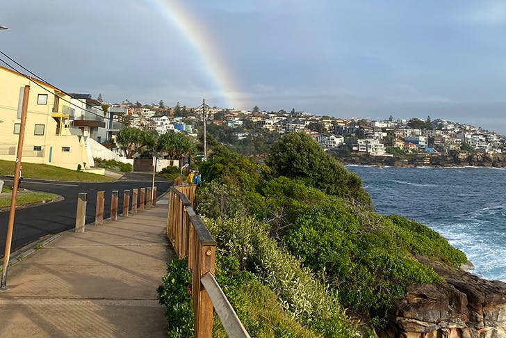 coastal walk with rainbow in sky