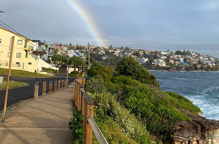 coastal walk with rainbow in sky