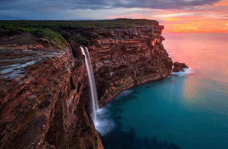 cliff waterfall at sunrise