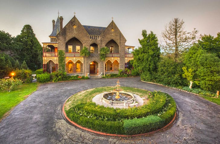 brick palace with circular driveway