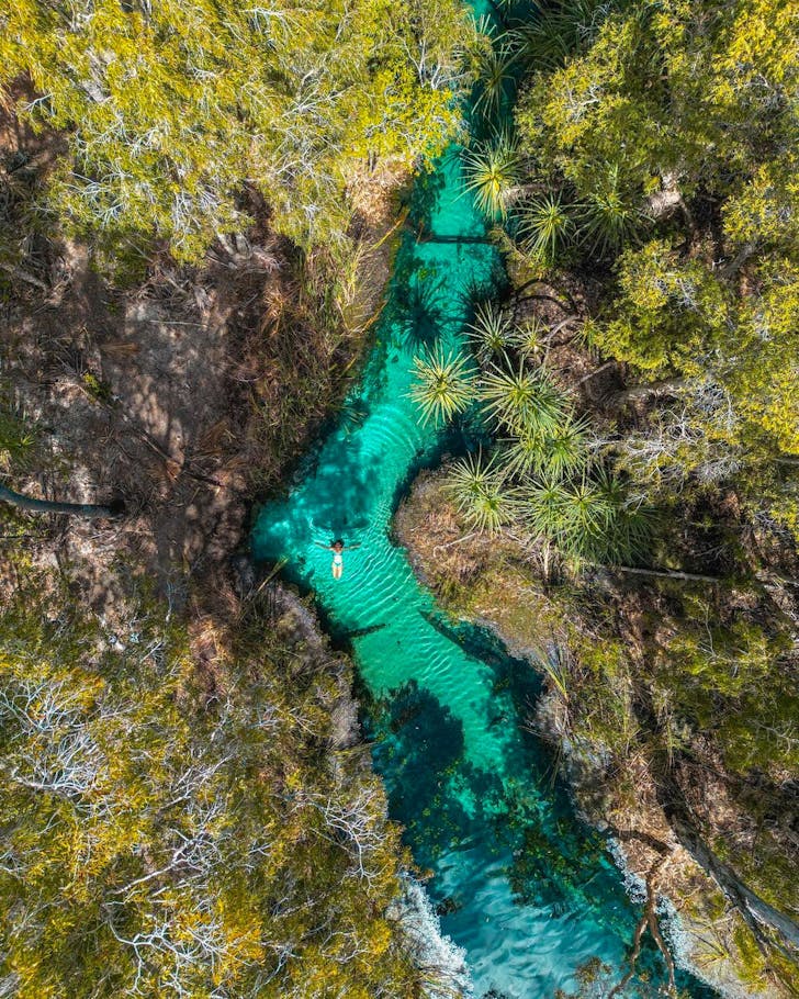 people floating in a river