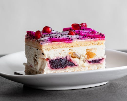 black star pastry's iconic dragon cake piped with vanilla cream and pomegranate jelly ripples