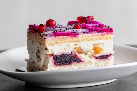 black star pastry's iconic dragon cake piped with vanilla cream and pomegranate jelly ripples
