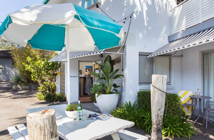 courtyard area of light filled motel in blueys beach