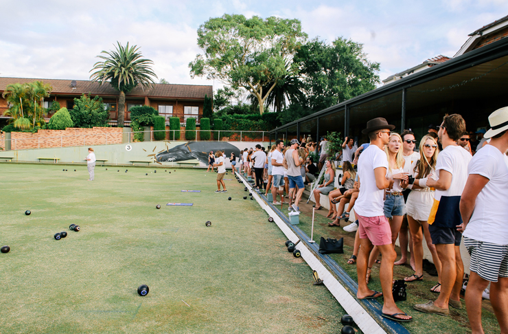 big crowd standing on lawn bowl pitch