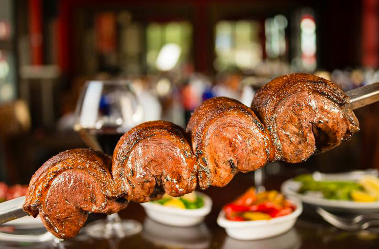slow cooked meat on metal rod
