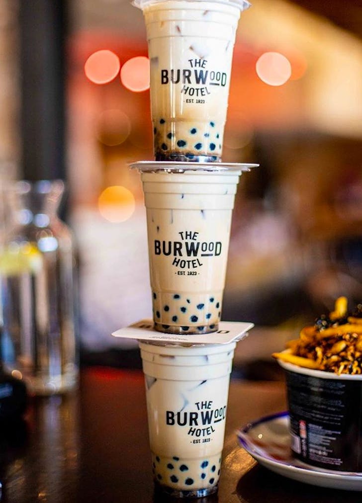 bubble tea cups stacked on top of one another