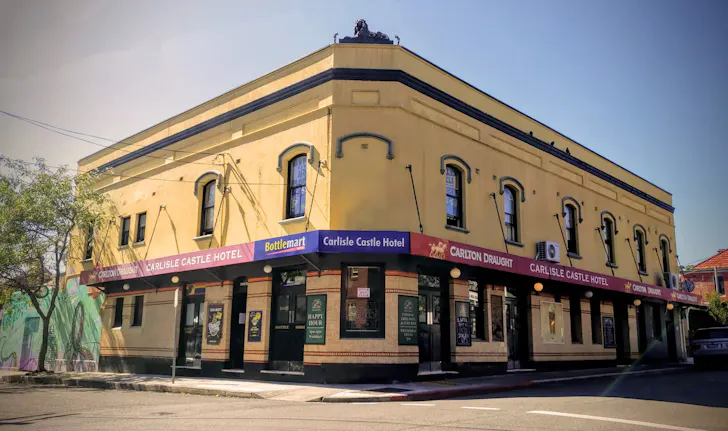 a pub on a corner on a sunny day