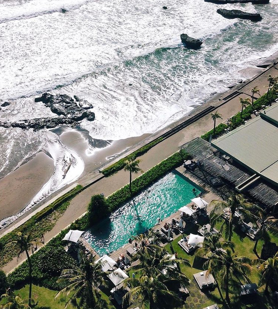 a hotel pool on the beach