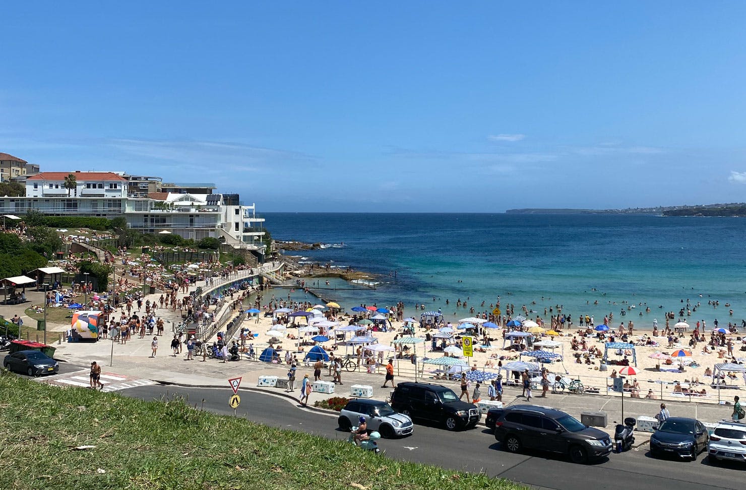 a crowded beach on a sunny day