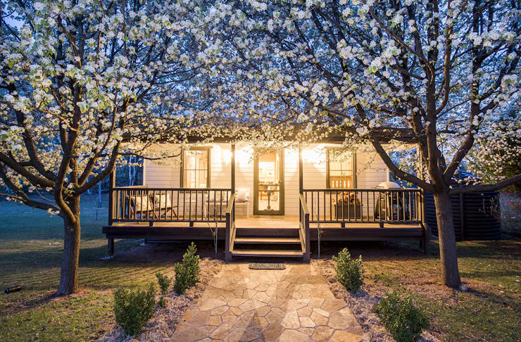 cottage lit up at night