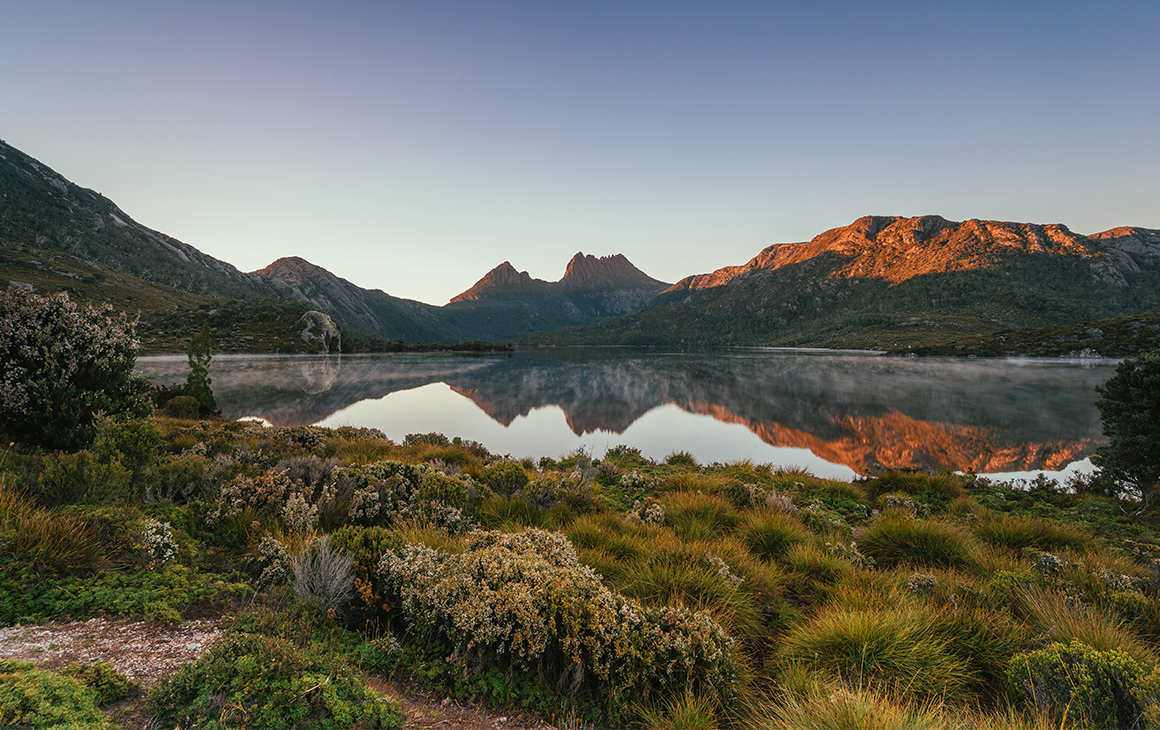 The evening sky reflects on Dove Lake at Cradle Mountain.