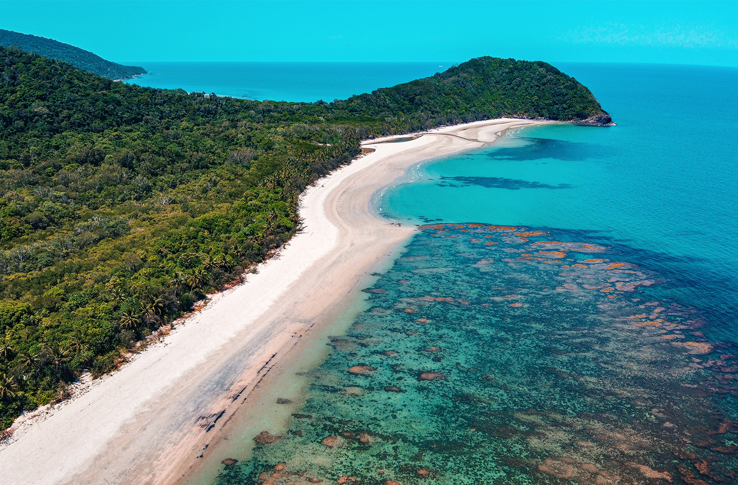 white sand beach and crystal clear water of cape tribulation