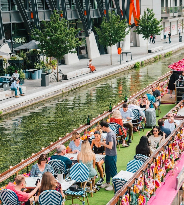 an open air cafe on a canal