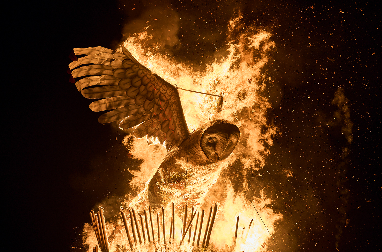 a structural owl on fire at night