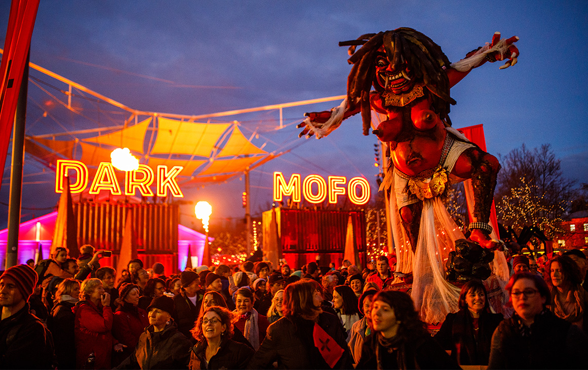 a crowd at a night festival