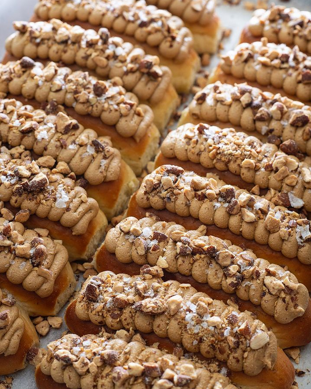 tray of finger buns with coffee frosting