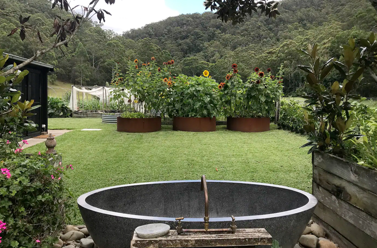 stone bath in landscaped garden