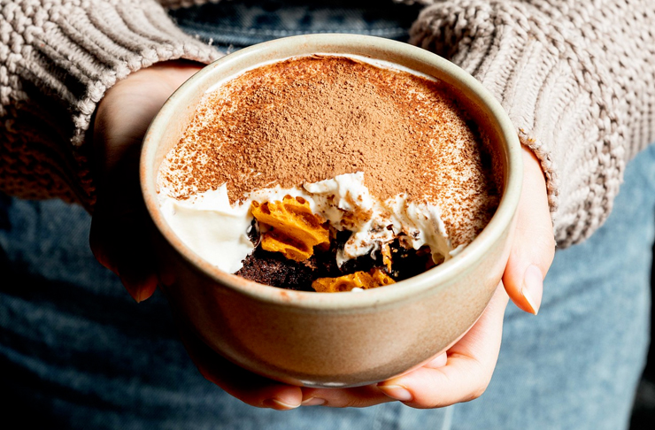 hand holding bowl of vietnamese tiramisu