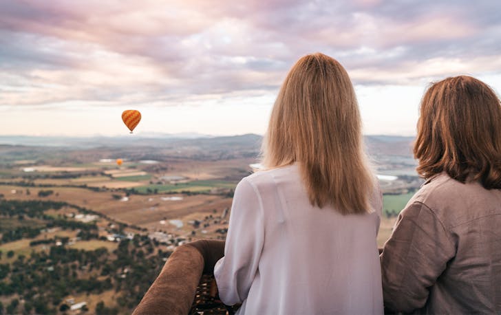 two people gazing out over the gold coast hinterland in a balloon