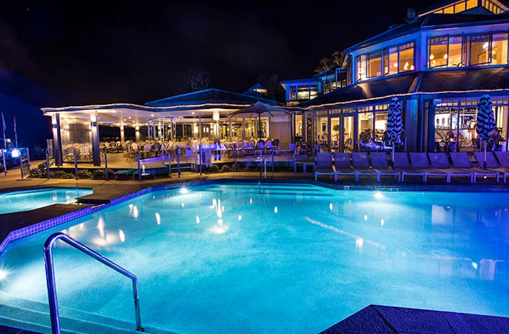 pool at night lit by lights