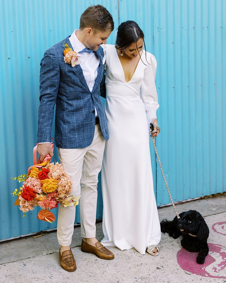 two people standing together on their wedding day