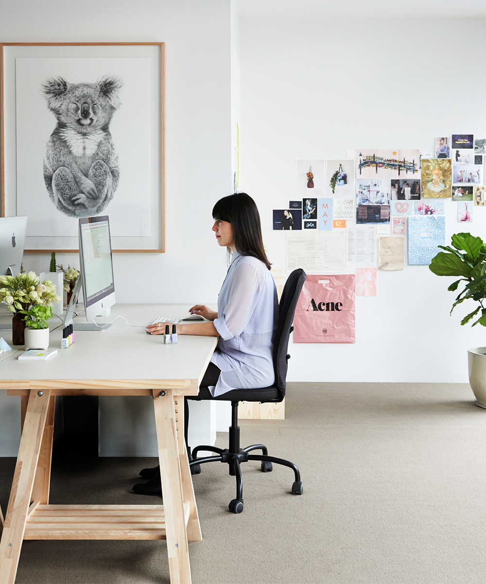 Anna Ross works at a computer in her Kester Black office.