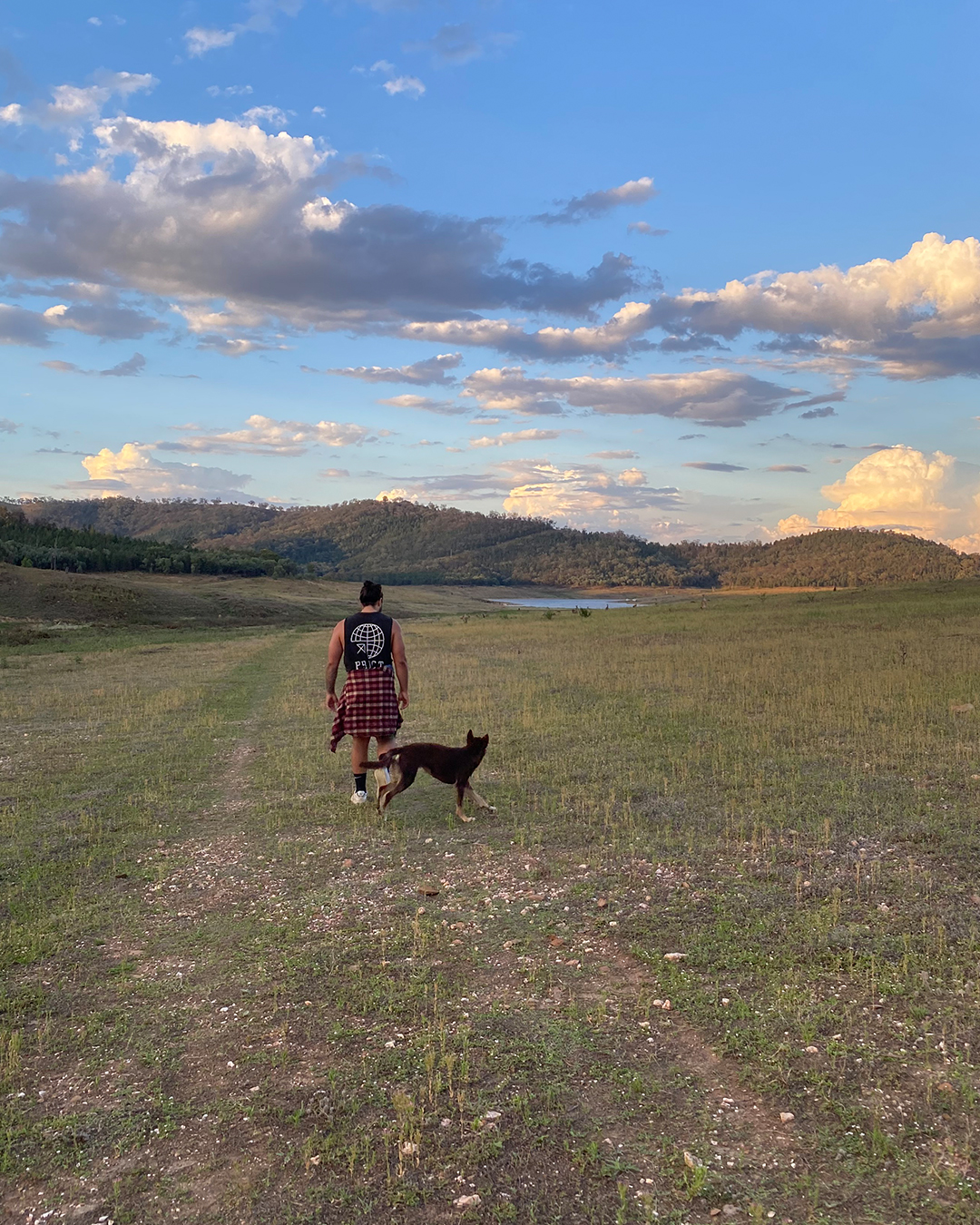 man walking with dog in Australian outback