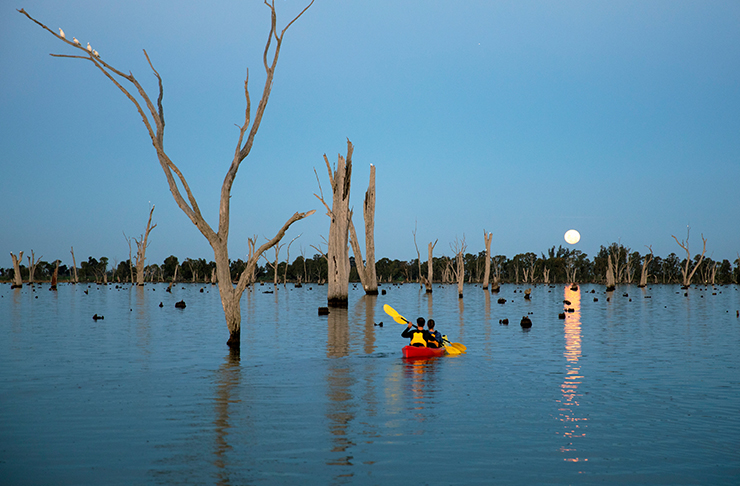 lake mulwala at full moon, two people in double kayak
