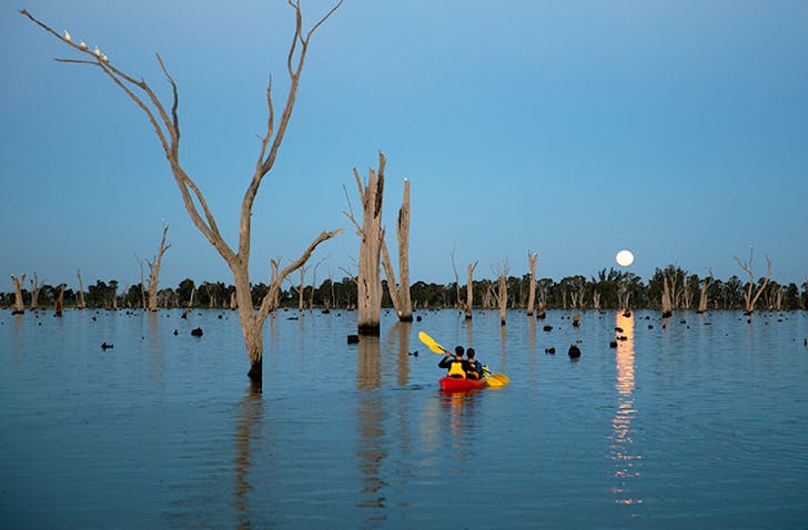 lake mulwala at full moon, two people in double kayak