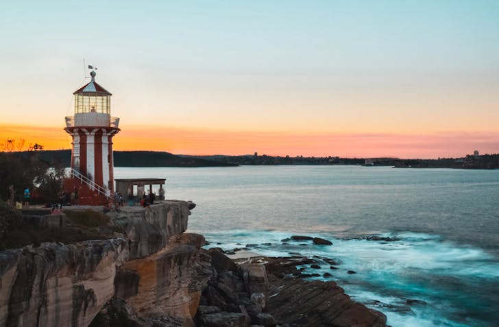 sunset view of south head walk â red and white striped horny lighthouse